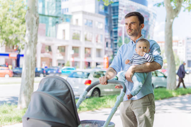 istock Father and baby son walking 1154940647