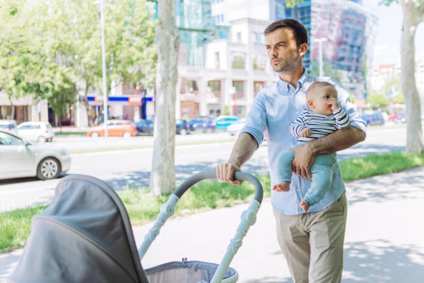 istock Father and baby son walking 1154940683