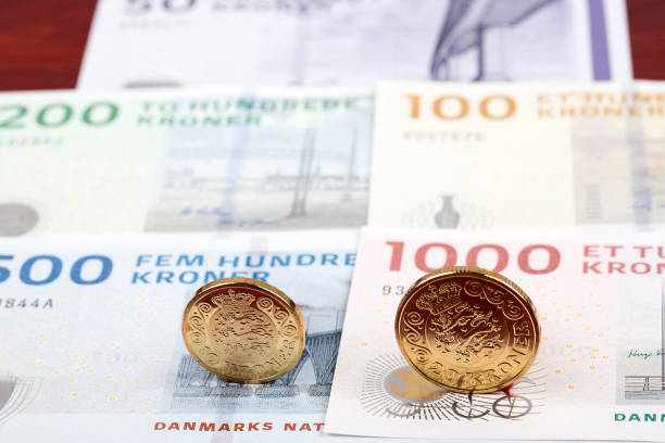 istock Danish coins on the background of banknotes 1154940684
