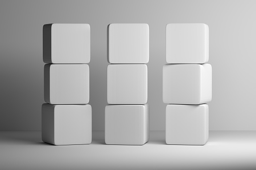 Pila de cubos blancos redondeados sobre fondo blanco photo