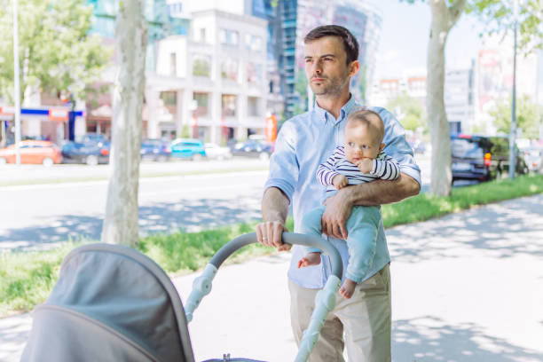 istock Father and baby son walking 1154940962