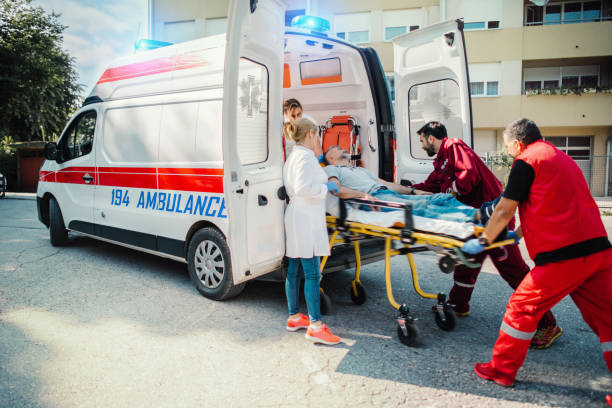 istock Paramedic team pushing stretcher 1154941059