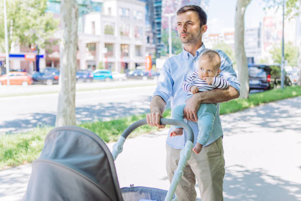 istock Father and baby son walking 1154941065