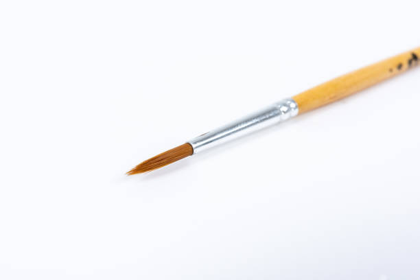 istock Painting brushes. Drawing tools, paint brushes on white background, copy space, top view 1154943500