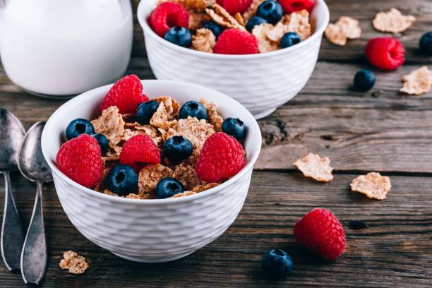 istock Whole Grain cereals with fresh blueberries and raspberries for breakfast. 1154945895