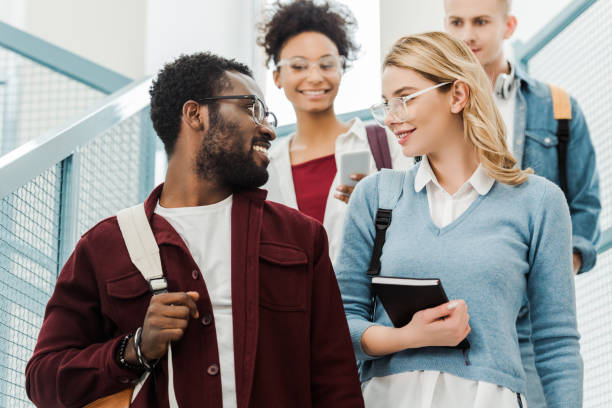 istock group of multiethnic students with backpacks in college 1154947955
