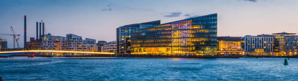 Copenhagen modern harbour redevelopment Vesterbro panorama illuminated sunset Denmark