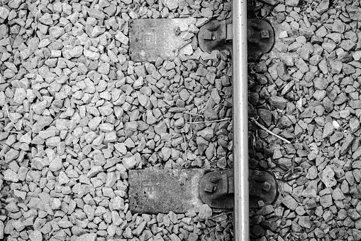 Black and white close-up of railway track over seven arches bridge in Ella, Sri Lanka
