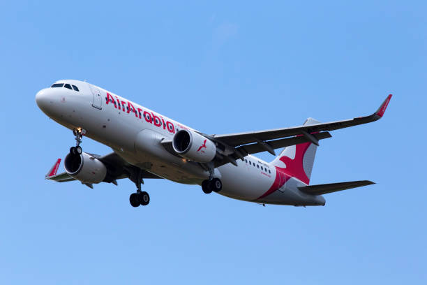A6-AOU Air Arabia Airbus A320-214(WL) aircraft on the blue sky background stock photo
