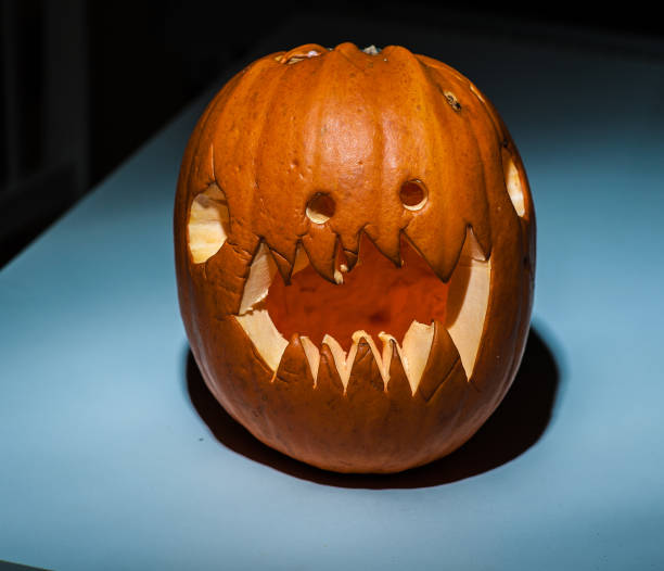 istock Carved out and scary pumpkin. 1154951815