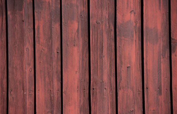 istock A weathered, old, wooden wall with vertical panelling. 1154952417