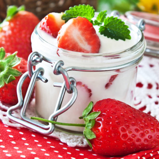istock Strawberries and yoghurt in a jar 1154953758