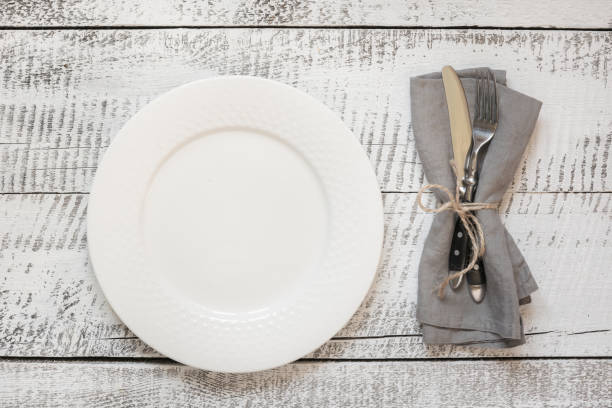 istock Elegant table place setting on white wooden table. Top view. 1154954651