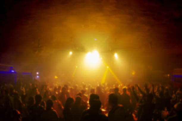 istock Blur Silhouettes shadow having fun in a club party. background with copy space. 1154956512