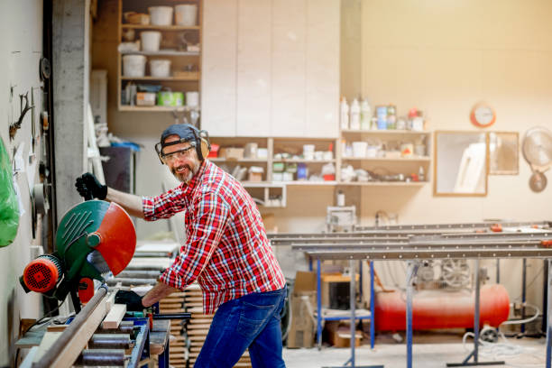 istock Carpenter cutting wood 1154956925