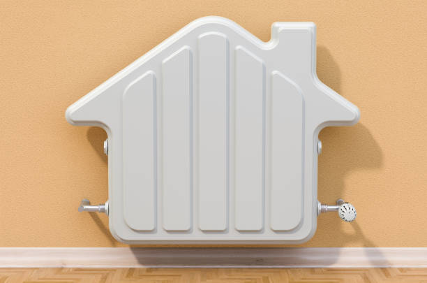 istock Heating radiator on the wall in the shape house 1154959737