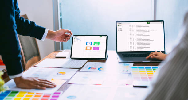 istock Businessman using laptop and tablet reading email screen connection communication. concept of working online system. 1154960840