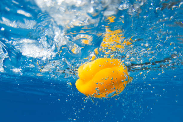 istock Bell pepper splashing in blue water. Underwater shot 1154961321