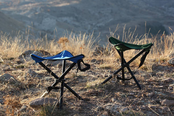 portable camping chairs in nature stock photo