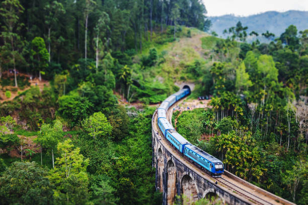Train on the Nine Arch Bridge in Sri Lanka. Travel to Ceylon island, popular travel  destination in Asia stock photo
