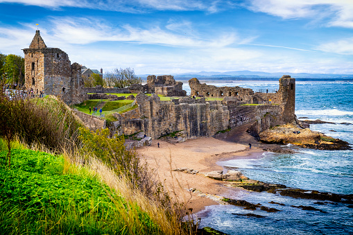St Andrews, Scotland - May 09,2019: The ruin of the St Andrew's Castle, located on a rocky promontory in St Andrews, Fife, Scotland. The castle, dating to the 1200s, now can be visited and hosts a visitor centre with displays on its history