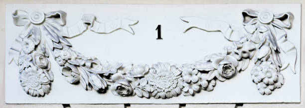 Number one on a facade with flowers