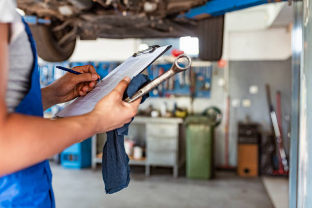 istock Mechanic engineer looking at service paper. 1154966009