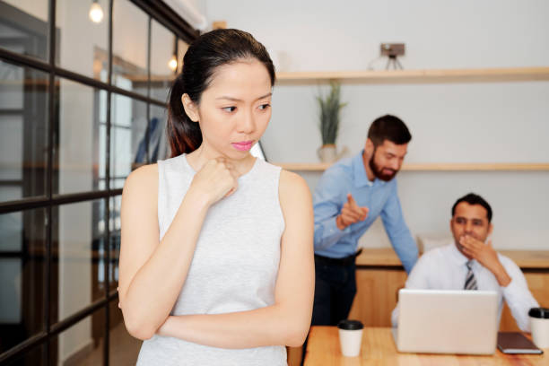 istock Pensive businesswoman standing at office 1154968511