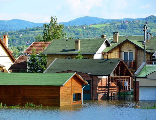 istock Flooded houses by the river 1154968780