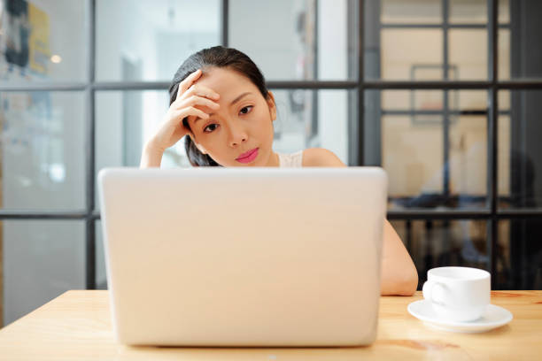 istock Young businesswoman working on laptop 1154969023