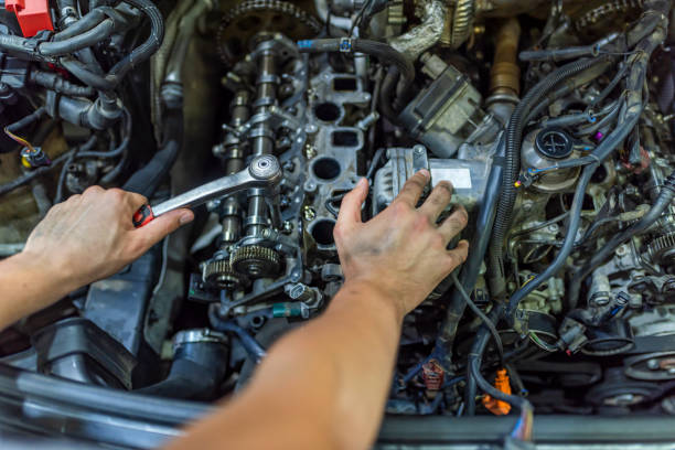 istock Auto mechanic working in garage. Repair service. 1154970684