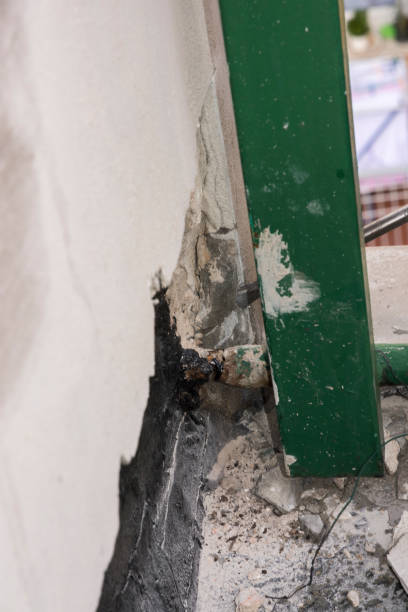 istock laying of waterproofing sheathing  and insulation on a roof 1154970802