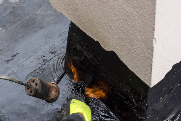 istock laying of waterproofing sheathing  and insulation on a roof 1154971077