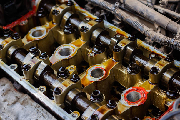 Disassembled internal combustion engine, close-up of the unit head Disassembled internal combustion engine, close-up of the unit head, overhaul, replacement of gaskets gasket stock pictures, royalty-free photos & images