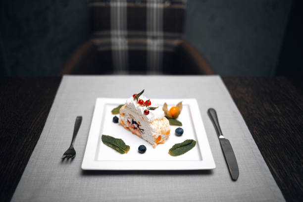 istock Desert cake on the square palate at the restaurant 1154972504
