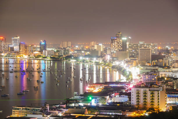 Pattaya city in evening. Skyscraper and building pattaya city. boats and ships in sea.