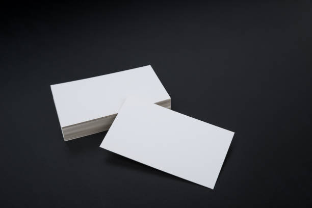 istock Business card, white clean on black background. 1154973270