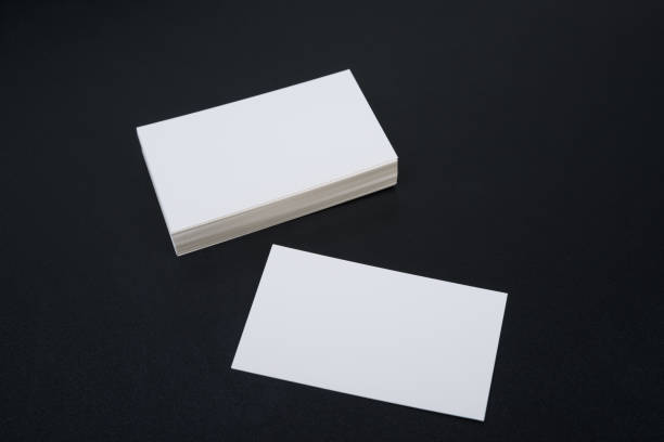 istock Business card, white clean on black background. 1154973412