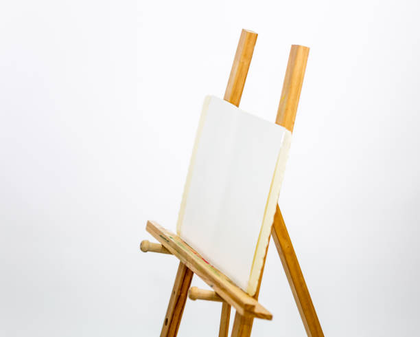 istock Artist's easel for painting on white background 1154977697