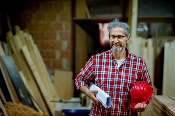 istock Senior quality inspector checking production line 1154978247