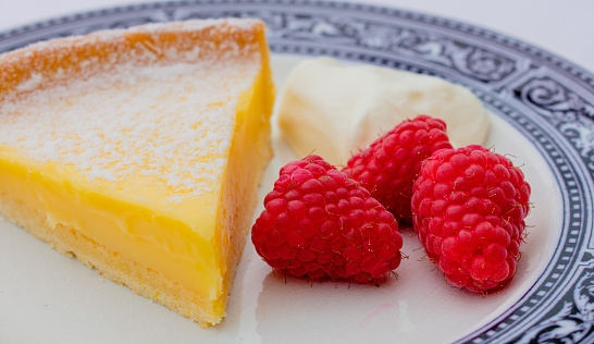 Tarte au citron or lemon tart is a dessert dish. It has a pastry shell with a lemon flavored filling