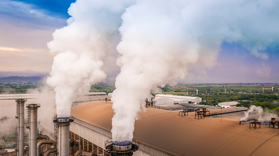 Smokestack pipe factory pollution in the city, Fuel Power Plant Smokestacks Emit Carbon Dioxide Pollution.