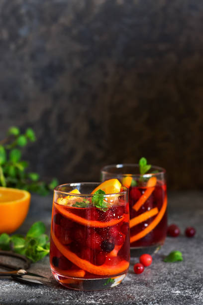 istock Cold cranberry juice with orange and mint. Summer drink. 1154982950
