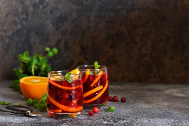 istock Cold cranberry juice with orange and mint. Summer drink. 1154982960