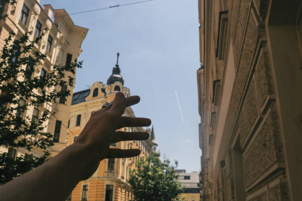 istock Walk through Vienna, the hand shows the sights 1154983418