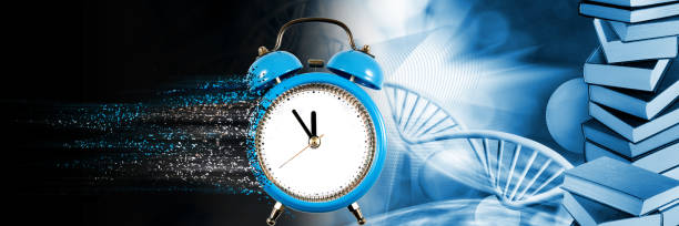 istock stylized image of the alarm clock against dna chain background 1154984022