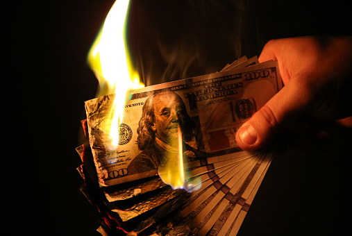 burning dollars money