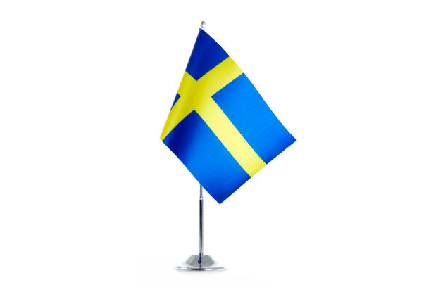 istock Swedish Flag stands on a white background 1154986785