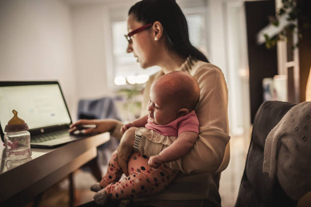 istock Young mother working and spending time with baby 1154986904