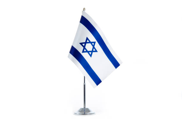 istock Israeli Flag stands on a white background 1154987102